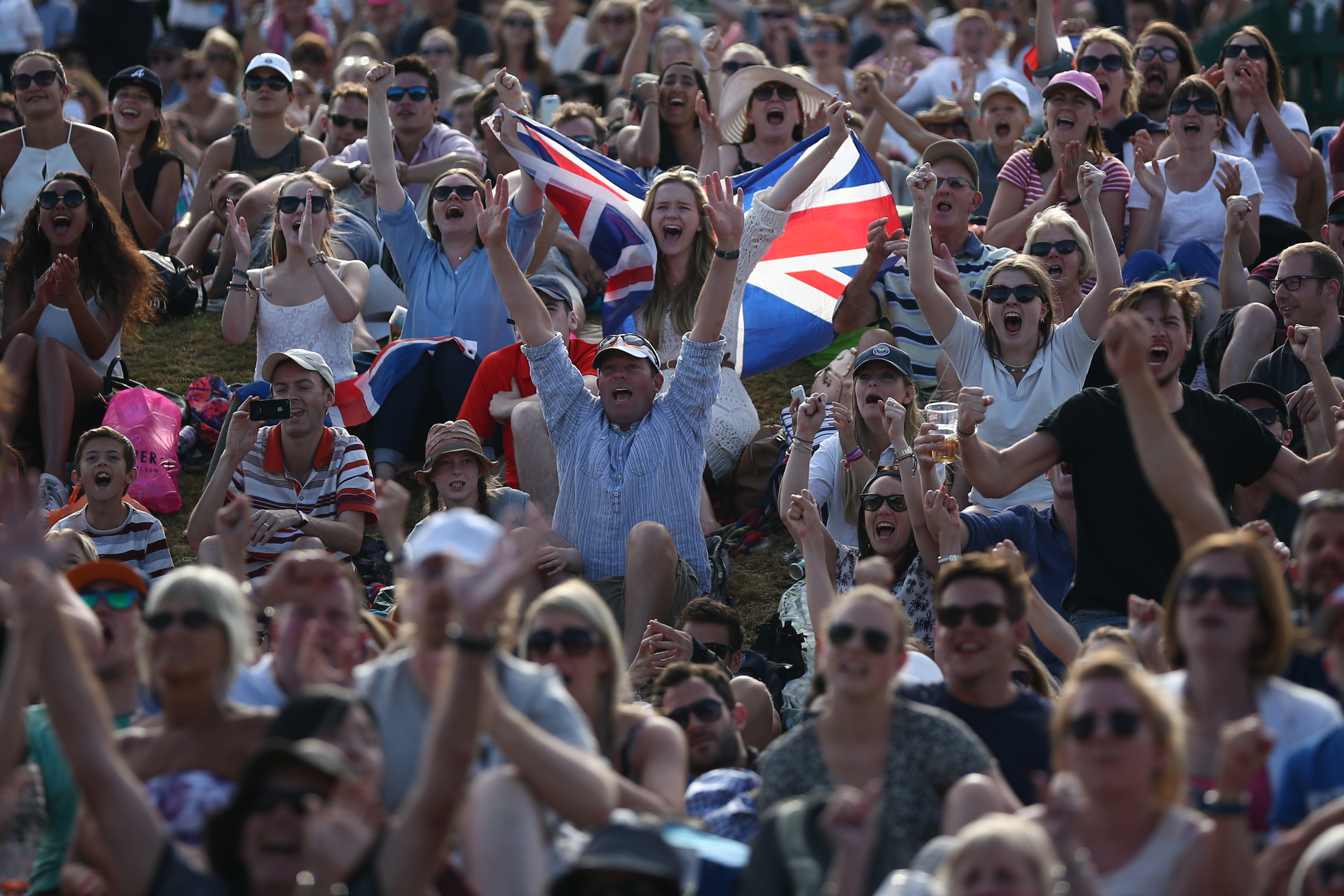 Crowd of sports fans celebrating at a sporting event