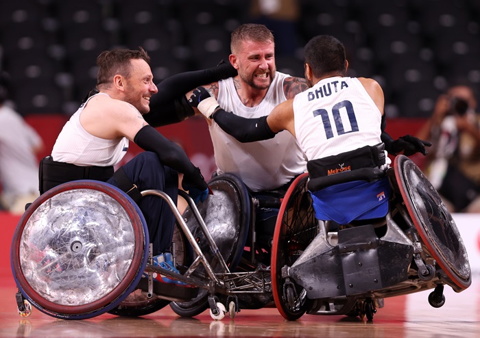 wheelchair rugby team celebrating in Tokyo